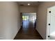Spacious hallway with hardwood floors leading into an open-concept living space at 4302 Emeline Way # 16, Fuquay Varina, NC 27526