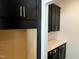 Dark kitchen cabinets with gold handles with matching countertop at 4302 Emeline Way # 16, Fuquay Varina, NC 27526