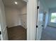 Spacious laundry room includes shelving and ample space for laundry appliances at 4302 Emeline Way # 16, Fuquay Varina, NC 27526