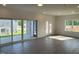 Bright living room with luxury vinyl plank flooring and sliding doors to a patio at 4302 Emeline Way # 16, Fuquay Varina, NC 27526