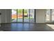 Spacious living room with luxury vinyl plank flooring and sliding doors to a patio at 4302 Emeline Way # 16, Fuquay Varina, NC 27526