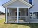 View of screened-in porch shows seamless indoor-outdoor living at 4302 Emeline Way # 16, Fuquay Varina, NC 27526