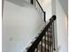 Wood stairs with black railing and white trim at 4302 Emeline Way # 16, Fuquay Varina, NC 27526