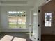 Light-filled study with a large window and glass french doors offers a functional workspace at 4302 Emeline Way # 16, Fuquay Varina, NC 27526