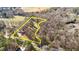 Expansive aerial view showcasing the property's vast land and wooded surroundings at 4775 Barber Mill Rd, Clayton, NC 27520