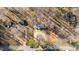 Aerial view of home and storage buildings on acreage with road frontage at 4775 Barber Mill Rd, Clayton, NC 27520