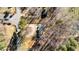 An overhead view of a home and acreage with storage shed and circular drive at 4775 Barber Mill Rd, Clayton, NC 27520