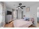 Inviting bedroom featuring hardwood floors, natural light, and decor at 4775 Barber Mill Rd, Clayton, NC 27520