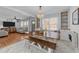 Dining area featuring lots of natural light, a chandelier, and a large wooden table with benches at 4775 Barber Mill Rd, Clayton, NC 27520