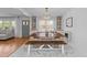 The dining area showcases a large table, a chandelier, and built-in shelving, perfect for Gathering dinners at 4775 Barber Mill Rd, Clayton, NC 27520