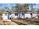 Back exterior of home featuring white brick and windows at 4775 Barber Mill Rd, Clayton, NC 27520