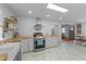 Kitchen featuring stainless steel appliances, butcher block countertops, and an open view to a dining area at 4775 Barber Mill Rd, Clayton, NC 27520