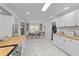 Spacious kitchen with bright white cabinets and an adjacent dining area at 4775 Barber Mill Rd, Clayton, NC 27520