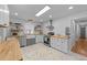 Bright, airy kitchen features stainless steel appliances, butcher block countertops, and white cabinets at 4775 Barber Mill Rd, Clayton, NC 27520