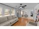 Open living space with hardwood floors flowing into the dining area with lots of natural light at 4775 Barber Mill Rd, Clayton, NC 27520