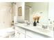 Bathroom featuring double sinks, framed mirror, and a tub with shower at 503 Gray Marble Rd, Morrisville, NC 27560