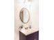 Modern bathroom featuring a sleek vanity, round mirror, and stylish accents at 503 Gray Marble Rd, Morrisville, NC 27560
