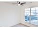 Cozy bedroom featuring a ceiling fan and a bright window with a view of the outdoors at 503 Gray Marble Rd, Morrisville, NC 27560