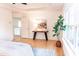 Serene bedroom featuring a tray ceiling, ample natural light, and a wood-style floor at 503 Gray Marble Rd, Morrisville, NC 27560