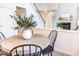Bright dining area featuring a round table, four chairs, and a decorative plant centerpiece at 503 Gray Marble Rd, Morrisville, NC 27560