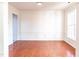 Bright dining room featuring hardwood floors, white trim, and natural light from the windows at 503 Gray Marble Rd, Morrisville, NC 27560