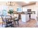 Well-lit kitchen with stainless steel appliances, center island, and an adjacent dining area at 503 Gray Marble Rd, Morrisville, NC 27560