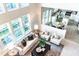 Bright living room with vaulted ceilings and many windows featuring a view to the kitchen and dining area at 503 Gray Marble Rd, Morrisville, NC 27560