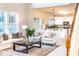 Open-concept living room showcasing natural light, neutral decor, and seamless flow to the kitchen at 503 Gray Marble Rd, Morrisville, NC 27560