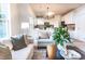 Cozy living space with seamless transition to a bright kitchen and a comfortable seating area at 503 Gray Marble Rd, Morrisville, NC 27560