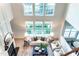 Bright and airy living room features large windows, fireplace and modern decor at 503 Gray Marble Rd, Morrisville, NC 27560