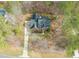 Overhead view of the home surrounded by lush greenery and mature trees at 5032 Big Creek Rd, Raleigh, NC 27613