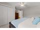 Bedroom with closet, bed, ceiling fan and view into a hallway at 5032 Big Creek Rd, Raleigh, NC 27613
