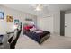 Bedroom with bed, computer desk, ceiling fan, and closet at 5032 Big Creek Rd, Raleigh, NC 27613