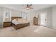 Spacious bedroom features a ceiling fan, natural light, and neutral tones creating a relaxing atmosphere at 5032 Big Creek Rd, Raleigh, NC 27613