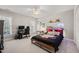 Bedroom with gaming setup, ceiling fan, and natural light from a window at 5032 Big Creek Rd, Raleigh, NC 27613