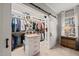 Well-organized walk-in closet features custom shelving and ample storage space for clothing and accessories at 5032 Big Creek Rd, Raleigh, NC 27613