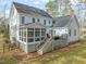 Backyard of home with a screened porch, a deck, and an outdoor grill for entertaining at 5032 Big Creek Rd, Raleigh, NC 27613