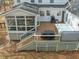 Aerial view of the backyard, featuring a hot tub, grill, deck, and screened porch at 5032 Big Creek Rd, Raleigh, NC 27613