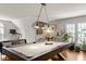 Open concept game room with pool table, a large window, and decorative plants at 5032 Big Creek Rd, Raleigh, NC 27613