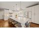 Spacious, bright kitchen with a large center island with seating and a full set of modern appliances at 5032 Big Creek Rd, Raleigh, NC 27613