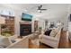 Bright living room featuring a fireplace, stylish decor, and hardwood flooring at 5032 Big Creek Rd, Raleigh, NC 27613