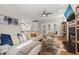 Spacious open-concept living room leading into the kitchen and decorated with a fireplace at 5032 Big Creek Rd, Raleigh, NC 27613