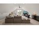 Bright and airy living room with sectional sofa and large windows allowing natural light at 5032 Big Creek Rd, Raleigh, NC 27613