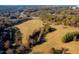 Expansive acreage featuring serene landscapes, interspersed with mature trees and a tranquil pond at 604 Copperline Dr # 108, Chapel Hill, NC 27516