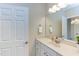 Bathroom with a vanity, large mirror, white cabinets, and neutral decor at 604 Copperline Dr # 108, Chapel Hill, NC 27516