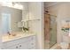 Bathroom features a large mirror, vanity, walk-in shower with glass door, and neutral color scheme at 604 Copperline Dr # 108, Chapel Hill, NC 27516