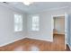 Bright bedroom with hardwood floors, a ceiling fan, and large windows with blinds at 604 Copperline Dr # 108, Chapel Hill, NC 27516