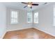 Bedroom featuring hardwood floors, base molding, and neutral paint with lots of light at 604 Copperline Dr # 108, Chapel Hill, NC 27516