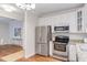 Well-equipped kitchen featuring stainless steel appliances and granite countertops at 604 Copperline Dr # 108, Chapel Hill, NC 27516