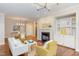 Bright living room featuring a fireplace, built-in shelving, and contemporary furnishings at 604 Copperline Dr # 108, Chapel Hill, NC 27516